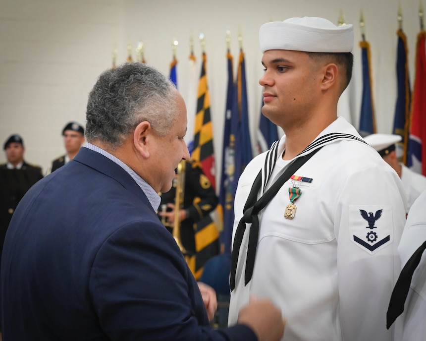 Secretary of the Navy Carlos Del Toro honored Puerto Rican veterans and servicemembers during a ceremony at the Navy Reserve Center (NRC) Puerto Rico, Feb. 8. Hosted by the American Legion Department of Puerto Rico, the event included a Chair of Honor solemn ceremony. Secretary Del Toro and Carmen Rosario, American Legion Puerto Rico Department Commander, draped the Prisoner of War and Missing in Action (POW/MIA) flag onto a single chair, while Taps played, remembering the 196 Puerto Rican Service members missing in action.