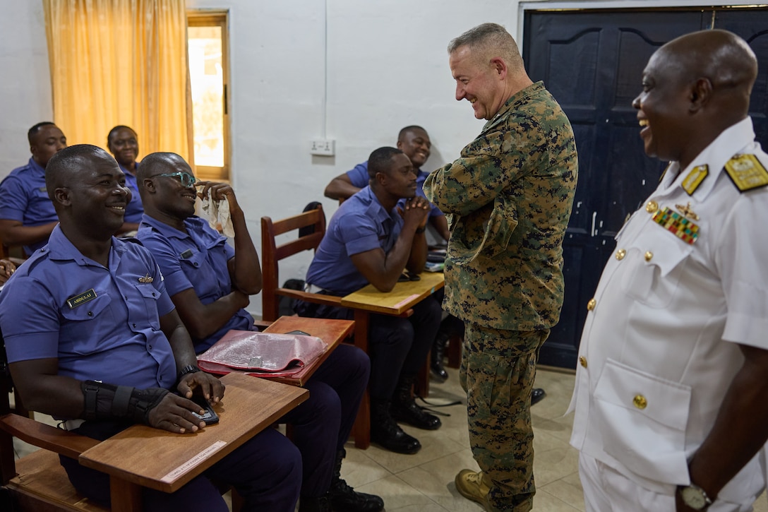 U.S. Marine Corps Maj. Gen. Robert B. Sofge Jr., commander of U.S. Marine Corps Forces Europe and Africa, and Commodore Maxwell Arhen, commander of the Eastern Naval Command, speak with Sailors attending classes at the TEMA Naval Base in Accra, Ghana on Feb. 6, 2024. During the visit Sofge received a tour of the facilities and engaged with key leaders of the Ghana Navy, where he addressed the importance of the U.S. Marines mission in Ghana and it's surrounding regions. (U.S. Marine Corps photo by Lance Cpl. Mary Linniman)