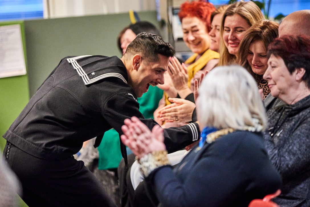 U.S. Navy MU3, Bobby Novoa, a musician with the U.S. Naval Forces Europe and Africa band, sings during a Naval Forces Europe and Africa Band concert at the Help Center for Ukranians in Helsinki, Finland, Jan. 27, 2024. The concert was held by the Naval Forces Europe and Africa Band as a means of engaging the community of displaced Ukrainian citizens living in Helsinki. (U.S. Marine Corps photo by Lance Cpl. Maxwell Cook)