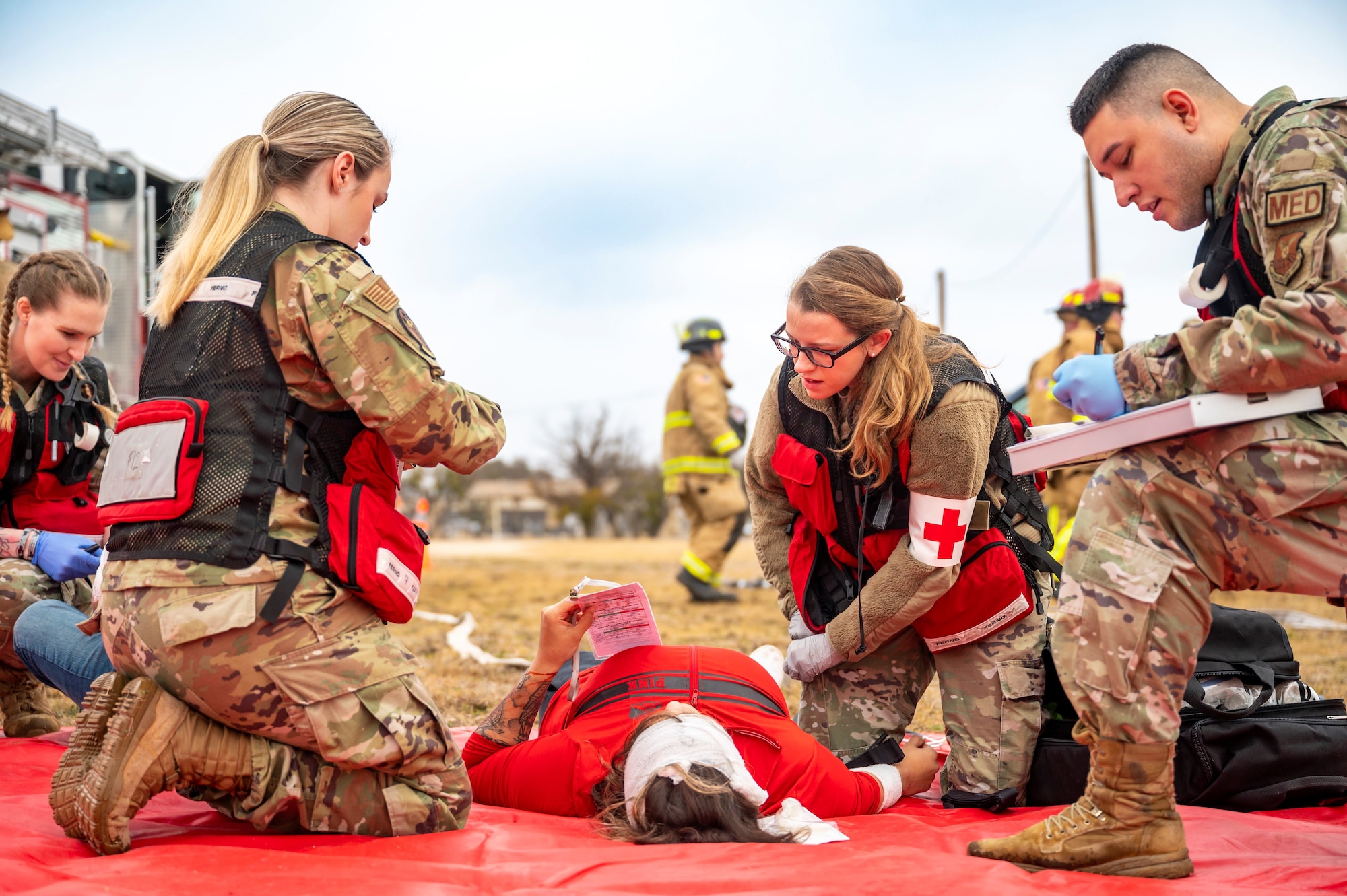 Airmen from the 7th Medical Group stabilize a simulated medical patient during the Ready Eagle II exercise capstone at Dyess Air Force Base, Texas, Jan. 25, 2024. Ready Eagle II was a 3-day medical training event to enhance the medical contingency response of the 7th MDG while testing and training multiple home station medical response teams. (U.S. Air Force photo by Senior Airman Leon Redfern)