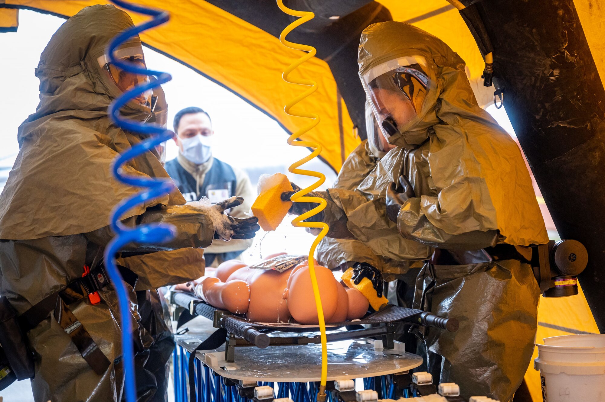 Airmen from the 7th Medical Group decontaminate a simulated medical patient during the Ready Eagle II exercise capstone at Dyess Air Force Base, Texas, Jan. 25, 2024. Ready Eagle II is an Air Force-wide directed training held to increase medical readiness for home station response to any medical emergencies or hazardous incidents. (U.S. Air Force photo by Senior Airman Leon Redfern)