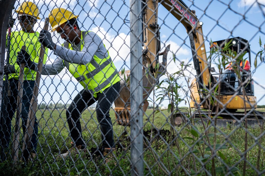 Engineers excavate and clear the land to prepare for construction of a new military housing community.