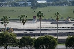 Engineers excavate and clear the land to prepare for construction of a new military housing community.