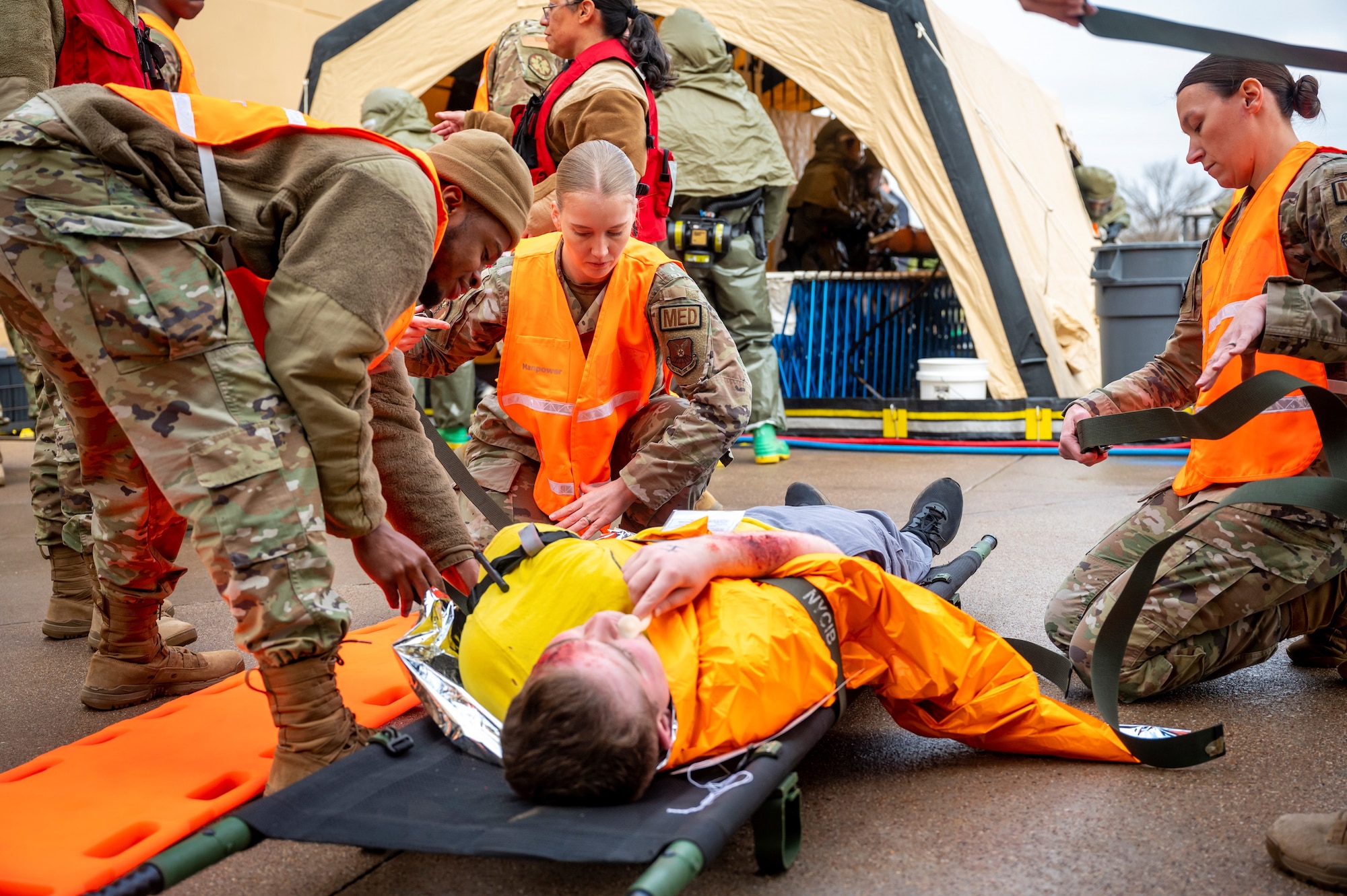 Airmen from the 7th Medical Group secure a simulated medical patient on a stretcher during the Ready Eagle II exercise capstone at Dyess Air Force Base, Texas, Jan. 25, 2024. Ready Eagle II was a 3-day medical training event to enhance the medical contingency response of the 7th MDG while testing and training multiple home station medical response teams. (U.S. Air Force photo by Senior Airman Leon Redfern)