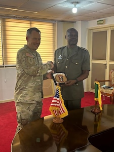 U.S. Army Maj. Gen. Todd R. Wasmund, commanding general of U.S. Army Southern European Task Force, Africa (SETAF-AF), poses for a photo with Benin Chief of Army Staff, Brig. Gen. Abou Issa, in Cotonou, Benin, Jan. 22, 2024. Wasmund and Issa discussed defense cooperation and opportunities for additional partnerships between the U.S. Army and the Benin Armed Forces.