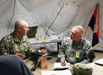 Lt. Gen. Michael Tucker (left), First Army commanding general, speaks with Brig. Gen. Blake Ortner, commanding general of the Virginia Army National Guard’s 29th Infantry Division, during the Warfighter Exercise 16-2 Nov.18, 2015, at Camp Atterbury, Ind.