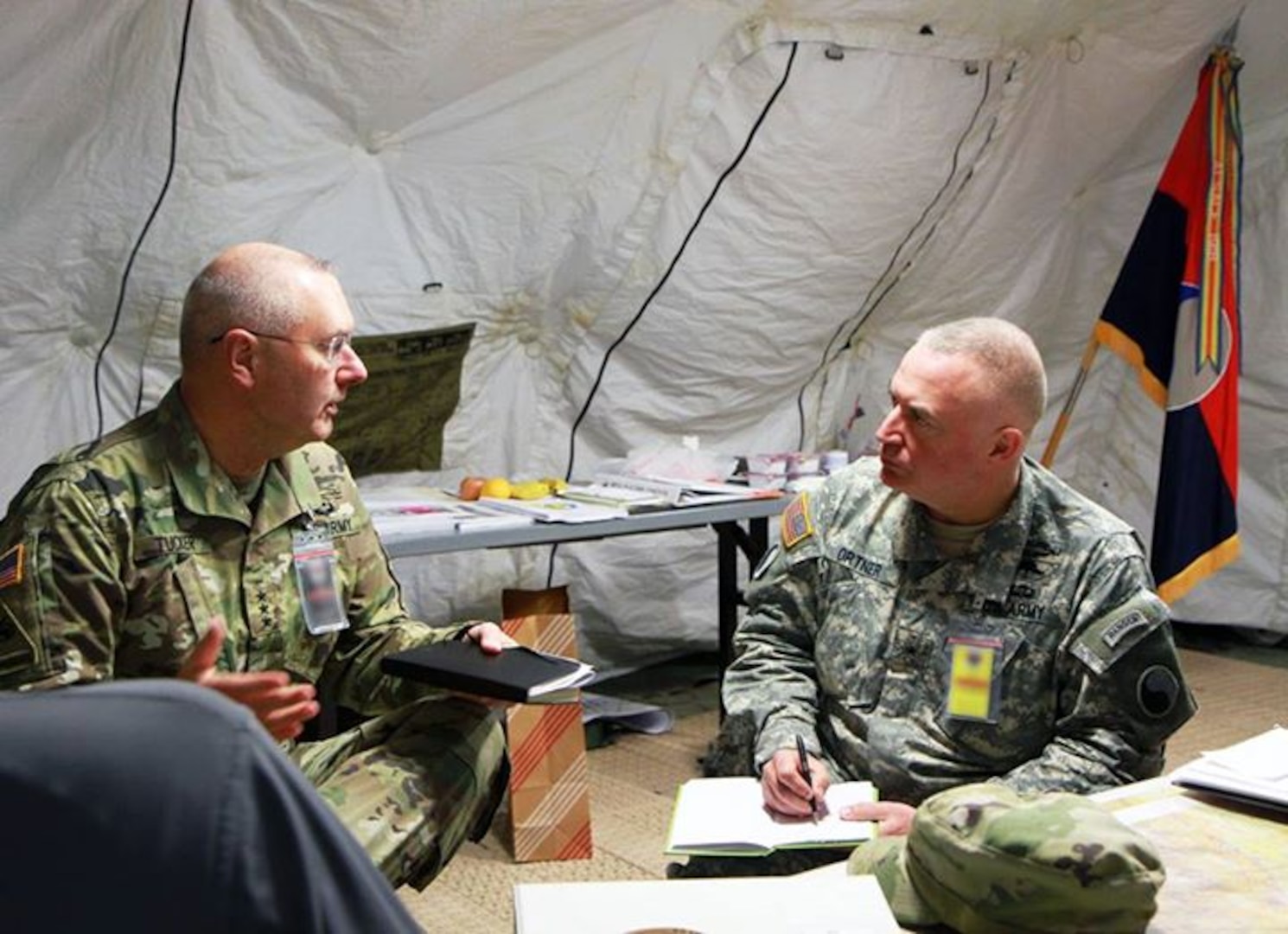 Lt. Gen. Michael Tucker (left), First Army commanding general, speaks with Brig. Gen. Blake Ortner, commanding general of the Virginia Army National Guard’s 29th Infantry Division, during the Warfighter Exercise 16-2 Nov.18, 2015, at Camp Atterbury, Ind.