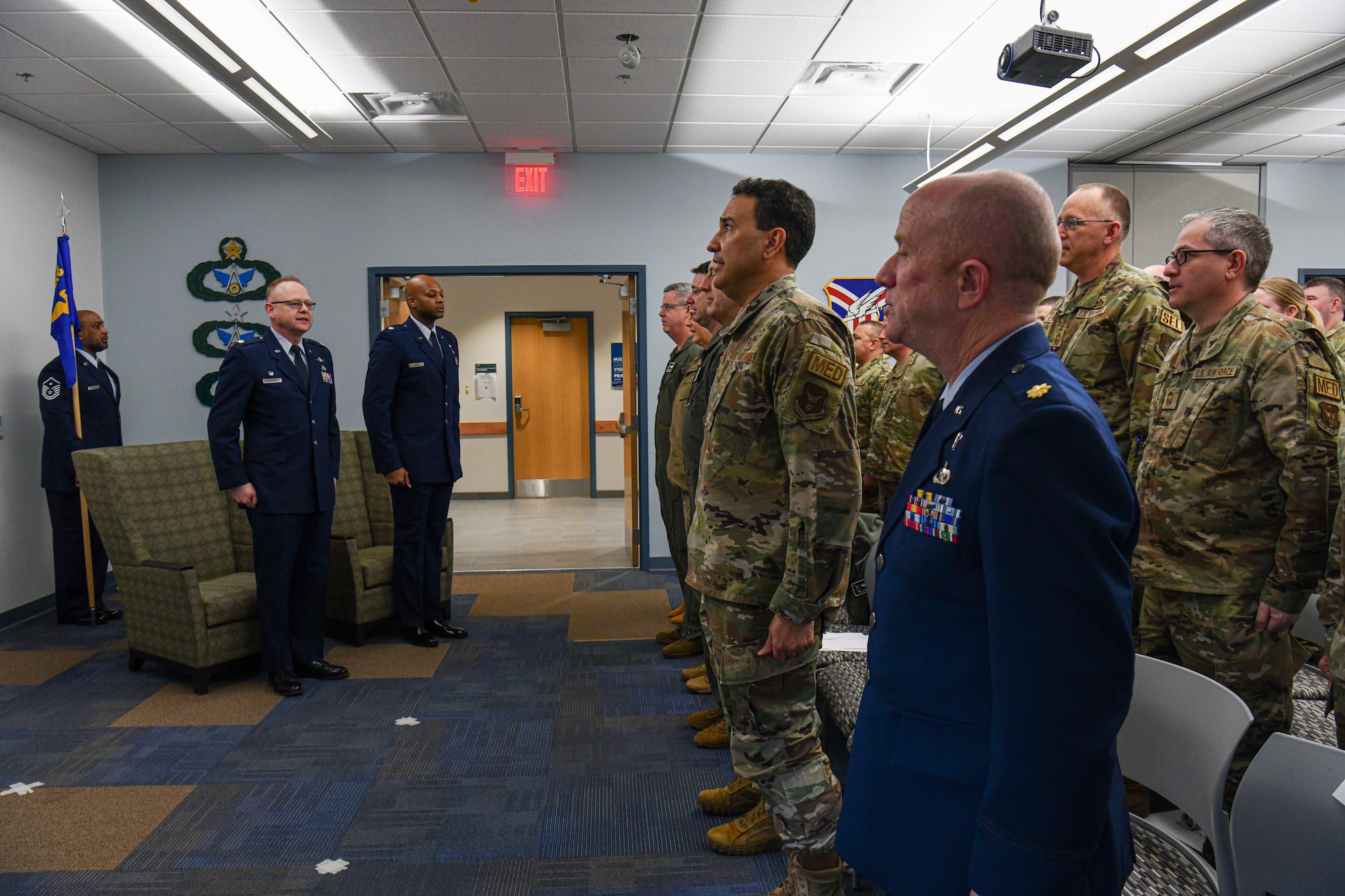 Airmen of the 910th Airlift Wing sing the Air Force song during the assumption of command ceremony of Maj. Mark Harris, the new commander of the 910th Civil Engineer Squadron, on Feb. 3, 2024, at Youngstown Air Reserve Station, Ohio.