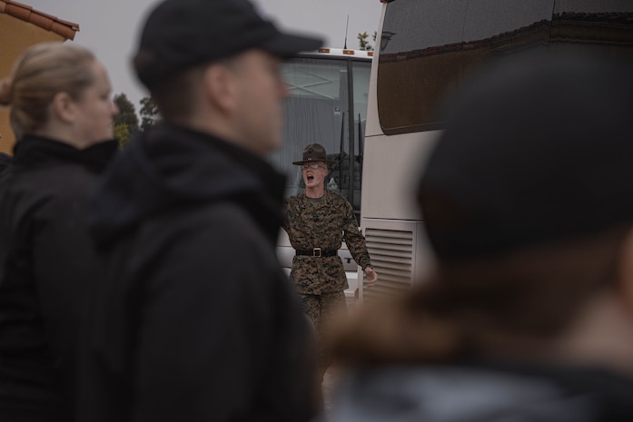 U.S. Marine Corps Sgt. Davis Wheat, a native of Fort Collins, Colorado, and a senior drill instructor with Support Battalion, Recruit Training Regiment, directs members of the Executive Leadership Development Program on the yellow footprints during a mock receiving event at Marine Corps Recruit Depot San Diego, California, Feb. 6, 2024. The purpose of the visit is to familiarize participants of the ELDP with the rigors or recruit training and highlight the uniqueness that distinguishes Marines from the other branches of the Armed Forces. (U.S. Marine Corps photo by Lance Cpl. Alexandra M. Earl)