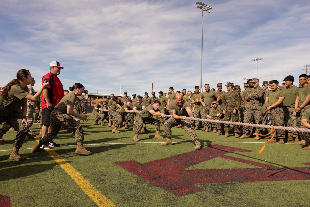 U.S. Marines with Marine Aviation Weapons and Tactics Squadron One, participate in tug-of-war challenge during the annual Super Squadron competition at Marine Corps Air Station Yuma, Arizona, Jan. 26, 2024. This controlled environment of games and group activities gave Marines and Sailors an opportunity to engage in a friendly competition, to promote unit cohesion and increase morale. (U.S. Marine Corps photo by Cpl. Jade K. Venegas)