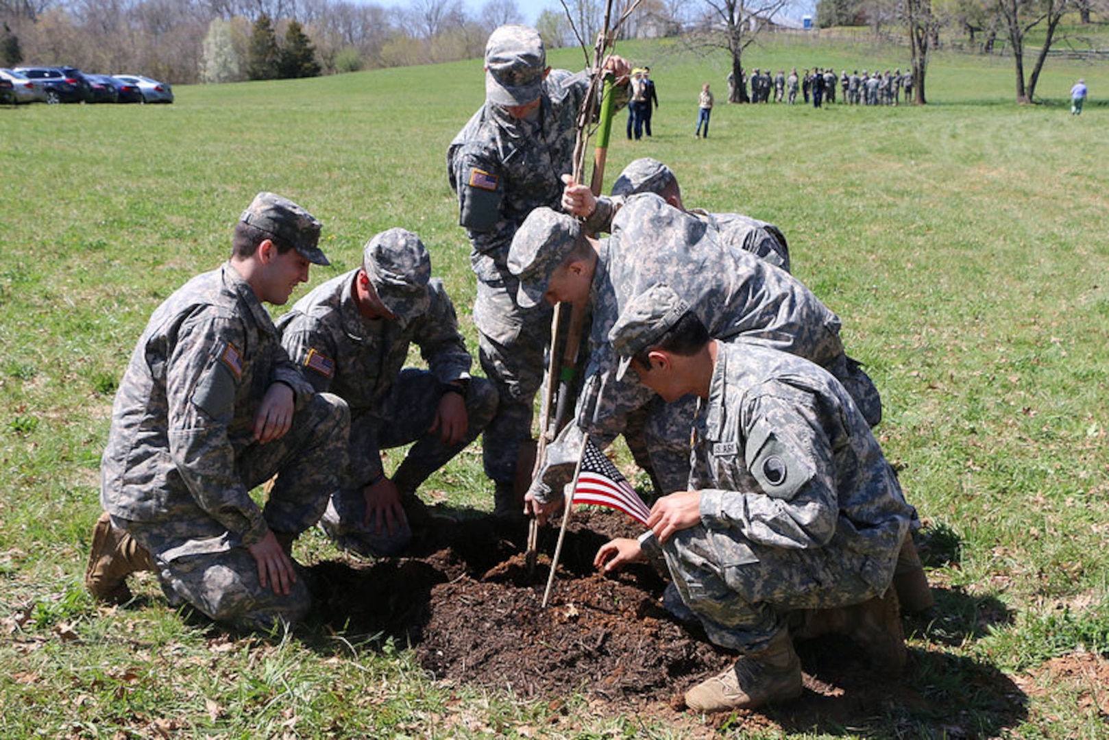 Virginia National Guard Soldiers from the Charlottesville-based Company A, 3rd Battalion, 116th Infantry Regiment, 116th Infantry Brigade Combat Team assist with planting 200 Rising Sun Redbud trees to honor fallen Civil War soldiers in support of the Living Legacy Tree Planting Project April 12, 2015, in Locust Dale, Va.