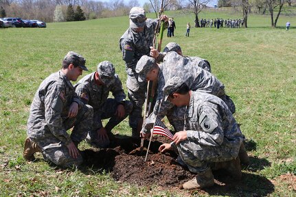 Virginia National Guard Soldiers from the Charlottesville-based Company A, 3rd Battalion, 116th Infantry Regiment, 116th Infantry Brigade Combat Team assist with planting 200 Rising Sun Redbud trees to honor fallen Civil War soldiers in support of the Living Legacy Tree Planting Project April 12, 2015, in Locust Dale, Va.