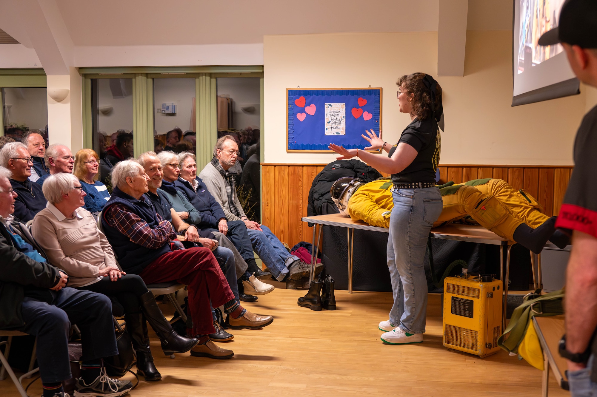 Members of the local community listen to a brief.