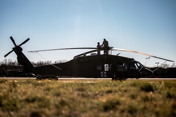 Soldiers with Charlie Company, 1st Battalion (Assault Helicopter Battalion), 244th Aviation Regiment, 90th Troop Command, Oklahoma Army National Guard perform maintenance on a UH-60 Black Hawk helicopter at Fort Cavazos, Texas, Jan. 9, 2024. The 244th AHB underwent rigorous pre-mobilization training in preparation for their upcoming deployment to Kosovo in support of Operation Joint Guardian. (Oklahoma National Guard photo by Cpl. Danielle Rayon)