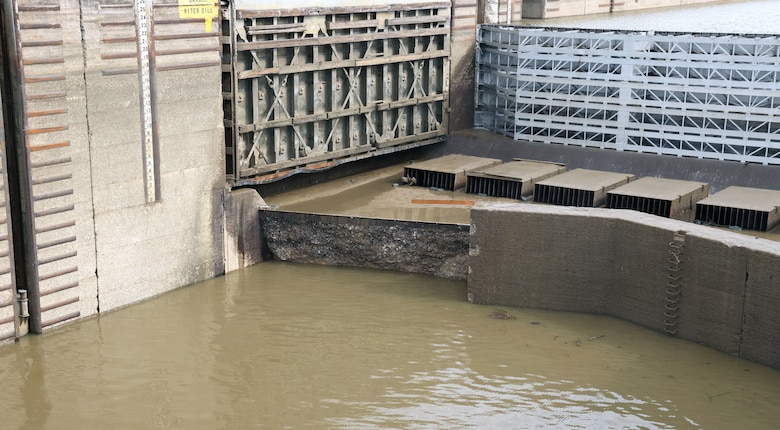 The lock chamber of the Demopolis Lock shows the large concrete portion of the upper sill that fell away on Feb. 3, 2024, Demopolis, Alabama. The Lock was breached on Jan. 16 when the sizeable concrete portion of the upper sill fell away; it has been inoperable until the sill can be repaired and fixed. (U.S. Army photo by Chuck Walker)