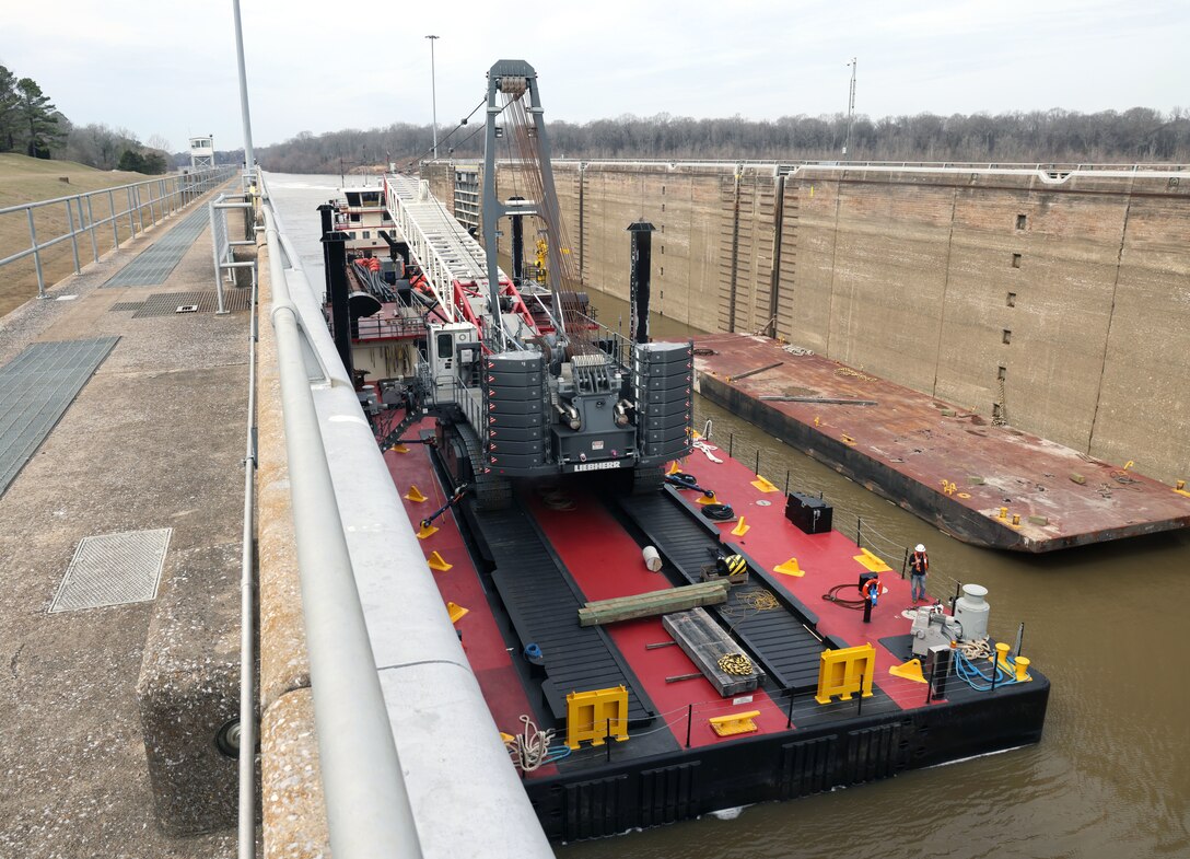 Vessels, floating barges, and cranes sit in the lock chamber of the Demopolis Lock, Demopolis, Alabama, Feb. 3, 2024. The Mobile District moved the vessels, barges, and cranes to the Demopolis Lock to assist in repairing the lock, which was damaged on Jan. 16 and has been inoperable ever since. (U.S. Army photo by Chuck Walker)