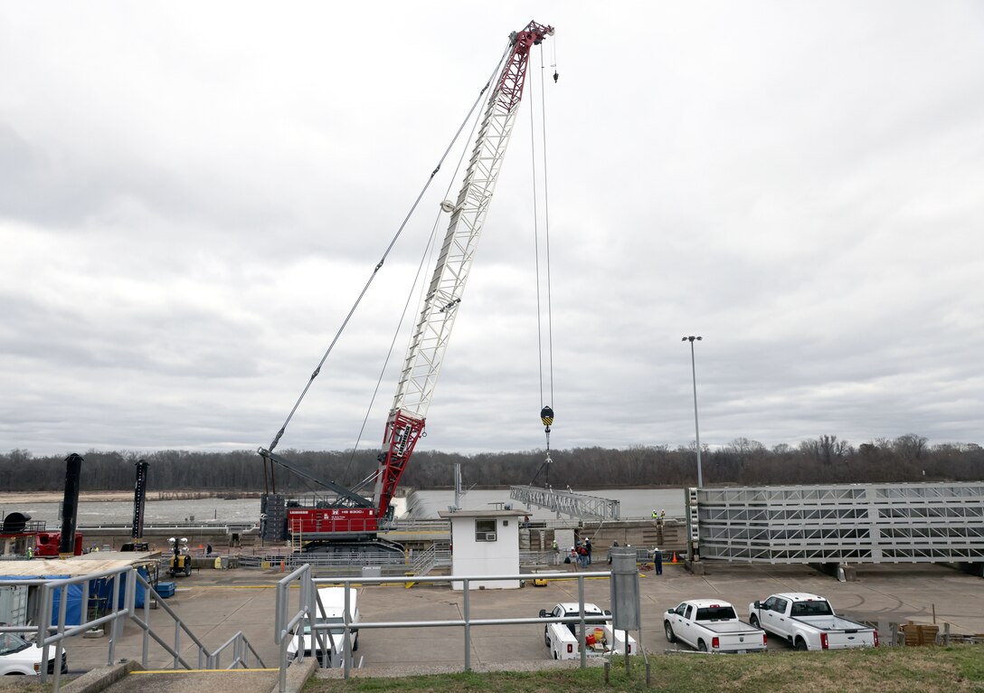 The Liebherr Crane from the Tennessee-Tombigbee Project Management Office moves the stoplog picking beam into place at the Demopolis Lock, Demopolis, Alabama, Feb. 5, 2024. The Tenn-Tom Project Office and other partners have assisted the Demopolis Lock in repairing it since it was severely damaged during a breach on Jan. 16. (U.S. Army photo by Chuck Walker)
