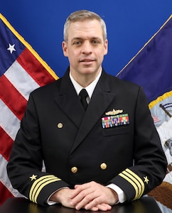 Commander Dustin T. Smith