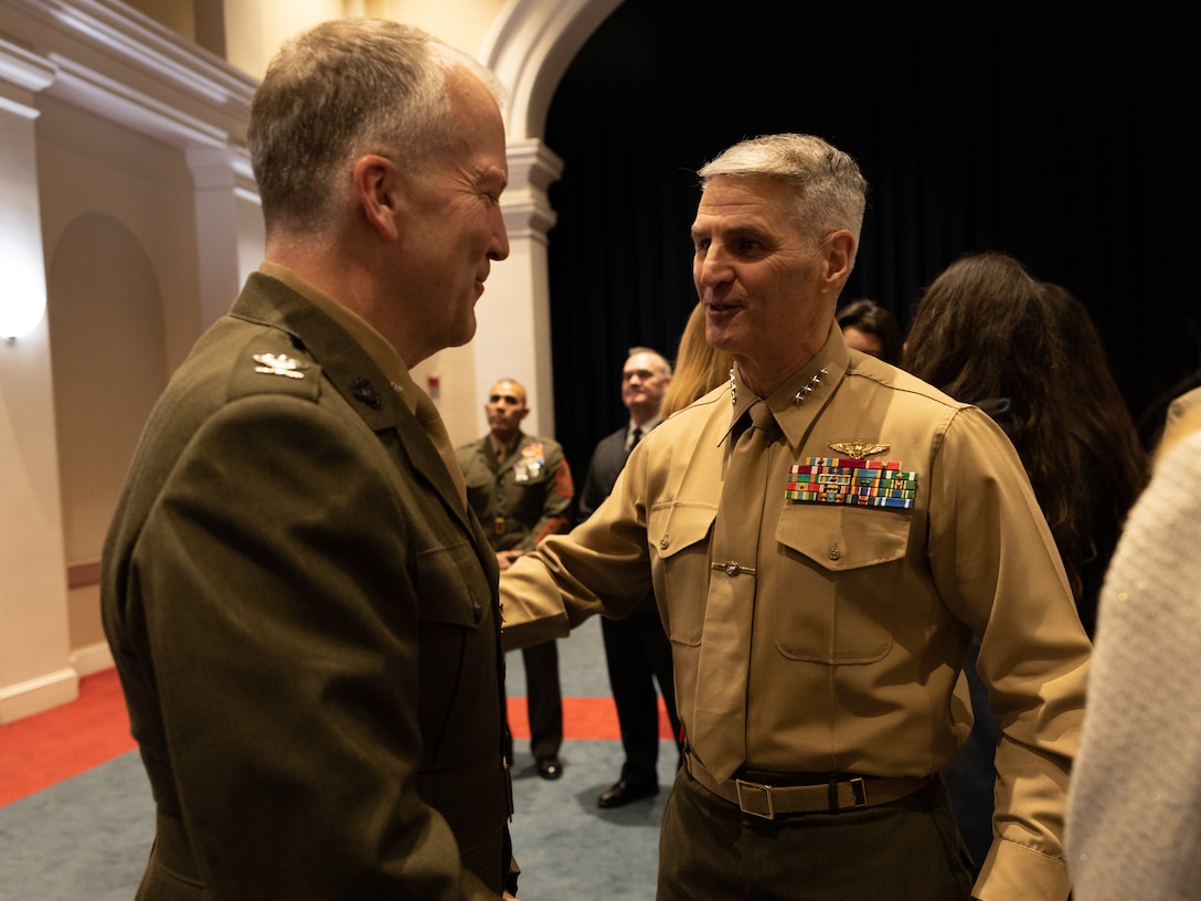 U.S. Marine Corps Gen. Christopher Mahoney, assistant commandant of the Marine Corps,  congratulates Col. Daniel Sullivan on his retirement during Sullivan’s retirement ceremony at Marine Barracks Washington, D.C, Feb. 1, 2024. During the ceremony, Sullivan was honored for his time in the Marine Corps and congratulated for his 30 years of service. Sullivan, with a notable service record spanning from 1993 to 2024, served across the globe with the U.S. Marine Corps. (U.S. Marine Corps photo by Lance Cpl. Sarah Pysher)