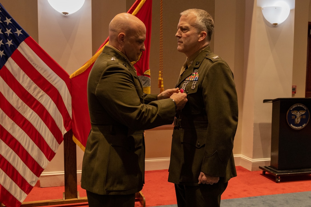 U.S. Marine Corps Lt. Gen. David Bellon (left), commander of Marine Forces Reserve and Marine Forces South, pins a Legion of Merit medal on Col. Daniel Sullivan during his retirement ceremony at Marine Barracks Washington, D.C., Feb. 1, 2024. During the ceremony, Sullivan was honored for his time in the Marine Corps and congratulated for his 30 years of service. The Marine Corps Reserve has more than 90,000 Marines with a vast range of skills and expertise gained from both military and civilian careers. (U.S. Marine Corps photo by Lance Cpl. Sarah Pysher)