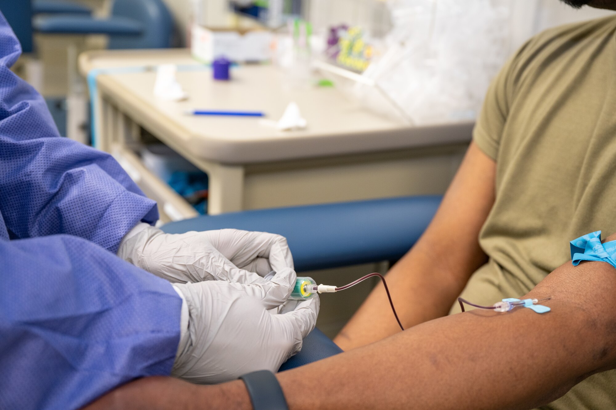 U.S. Air Force Staff Sgt. Brandon Rickard, 1st Special Operations Medical Group non-commissioned officer in charge of laboratory shipping, performs a routine blood draw on a patient at Hurlburt Field, Florida, Feb. 7, 2024. The 1st SOMDG laboratory provides essential medical support to all members of Team Hurlburt, including military dependents and retirees, ensuring access to basic healthcare. (U.S. Air Force photo by Senior Airman Alysa Calvarese)