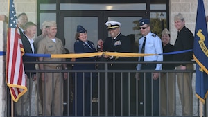 U.S. Air Force Col. Angelina Maguinness, 17th Training Wing Commander, and U.S. Navy Lt. Cmdr. Nicholas Leyba Center for Information Warfare Training Command Monterey, Detachment Goodfellow Headquarters commander shake hands upon completion of the Navy Ribbon Cutting Ceremony at Goodfellow Air Force Base Feb. 2, 2024. Due to a cold front in the winter of 2021, the original building was out of code and needed renovation; it was soon demolished. They renovated another building and decided to add a wing, which is now the headquarters quarterdeck/entryway, training room, gym, and additional office space. (U.S. Air Force photo by 2nd Lt. Kayunna Holt)