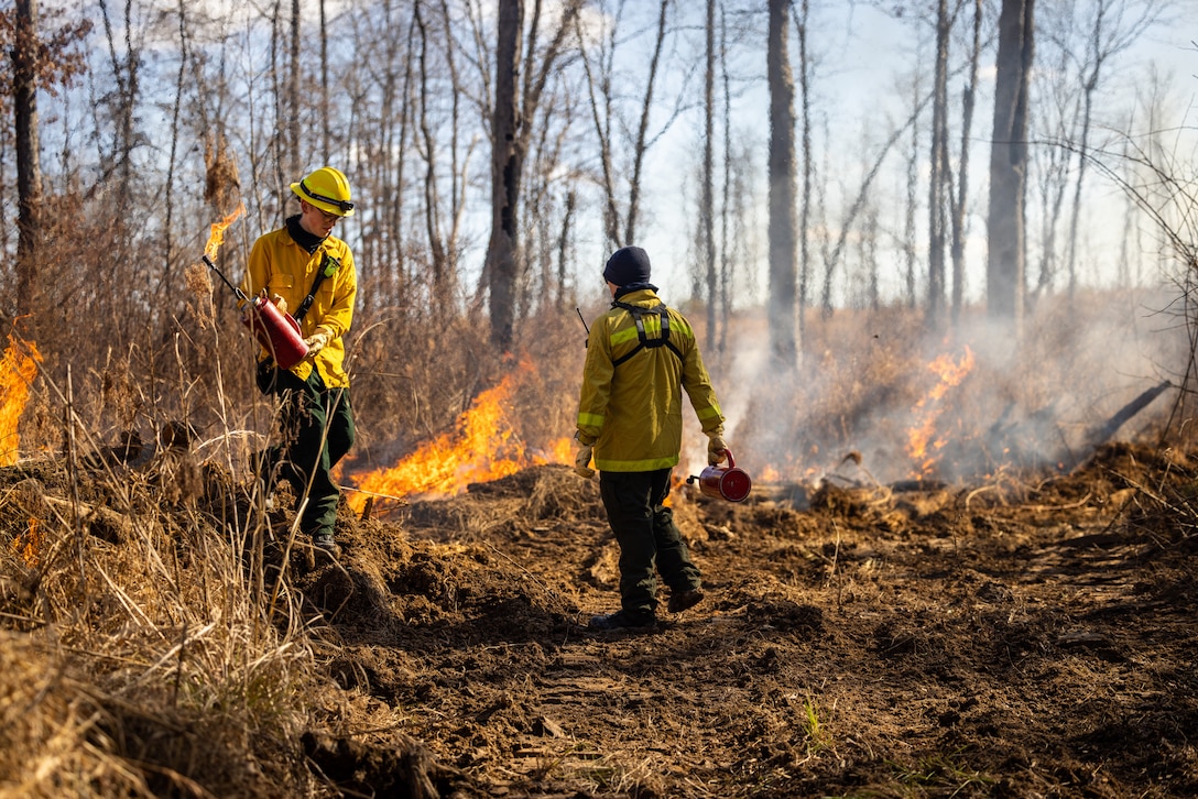Brehm Corbin, a firefighter with Quantico Fire and Emergency Services, conducts a controlled burn on Marine Corps Base Quantico, Virginia, Feb. 6, 2024. The purpose of the burns is to reduce fuel litter, minimize the potential of wildfires, and promote wildlife habitat. (U.S. Marine Corps photo by Lance Cpl. Joaquin Dela Torre)