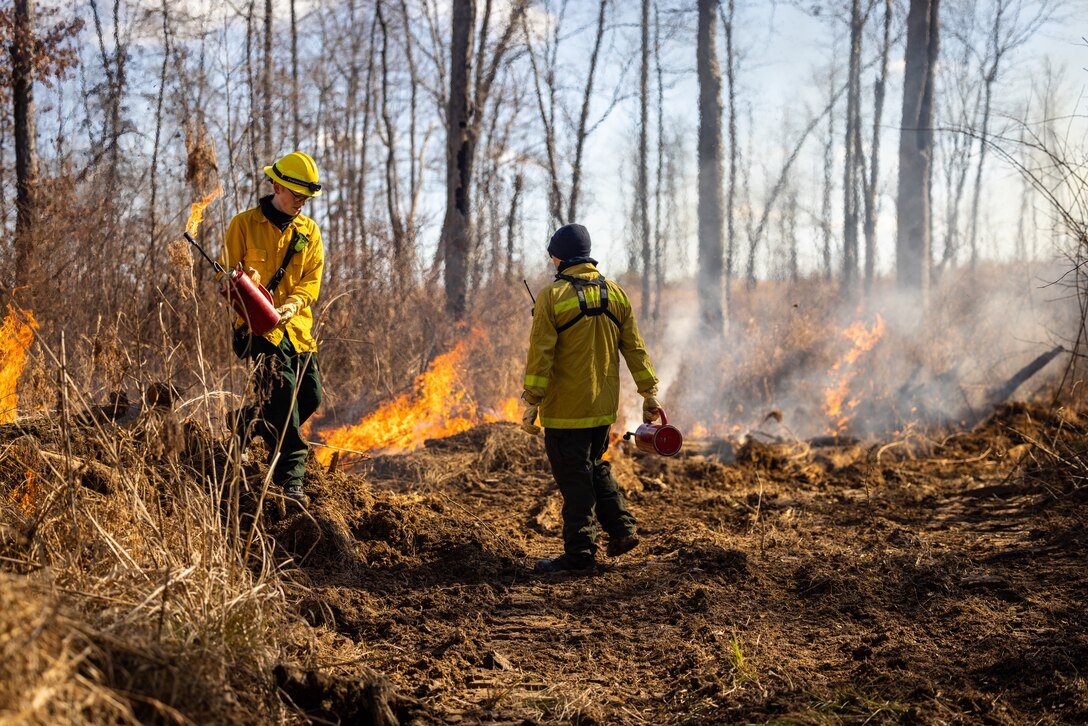 Brehm Corbin, a firefighter with Quantico Fire and Emergency Services, conducts a controlled burn on Marine Corps Base Quantico, Virginia, Feb. 6, 2024. The purpose of the burns is to reduce fuel litter, minimize the potential of wildfires, and promote wildlife habitat. (U.S. Marine Corps photo by Lance Cpl. Joaquin Dela Torre)