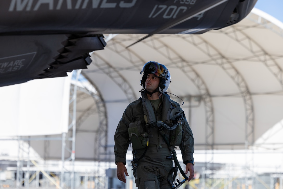 U.S. Marine Corps Maj. Andrew Bonell, an F-35B Lightning II pilot with Marine Fighter Attack Squadron (VMFA) 214, Marine Aircraft Group 13, 3rd Marine Aircraft Wing, conducts preflight checks on an F-35B Lightning II aircraft before suppression of enemy air defense training during Exercise Steel Knight 23.2 at Marine Corps Air Station Yuma, Arizona, Dec. 5, 2023. SEAD training increases the ability of fifth-generation fighter pilots to enter the fight first, strike targets deep within an enemy air defense system, and enable follow on strikes by supporting weapons platforms. Steel Knight 23.2 is a three-phase exercise designed to train I Marine Expeditionary Force in the planning, deployment and command and control of a joint force against a peer or near-peer adversary combat force and enhance existing live-fire and maneuver capabilities of the Marine Air-Ground Task Force. (U.S. Marine Corps photo by Cpl. Jade K. Venegas)
