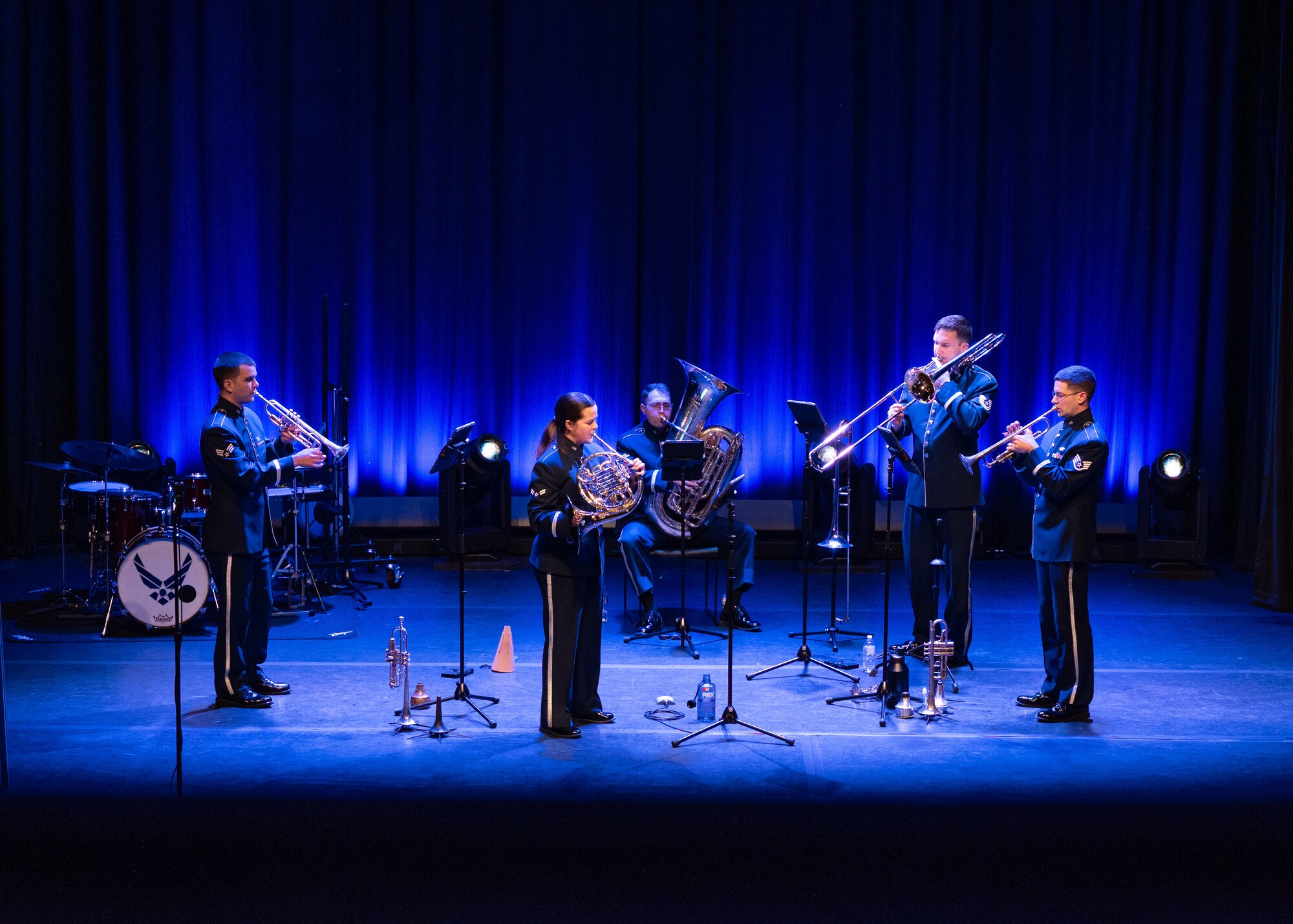 Five members of Heritage Brass ensemble performs on stage