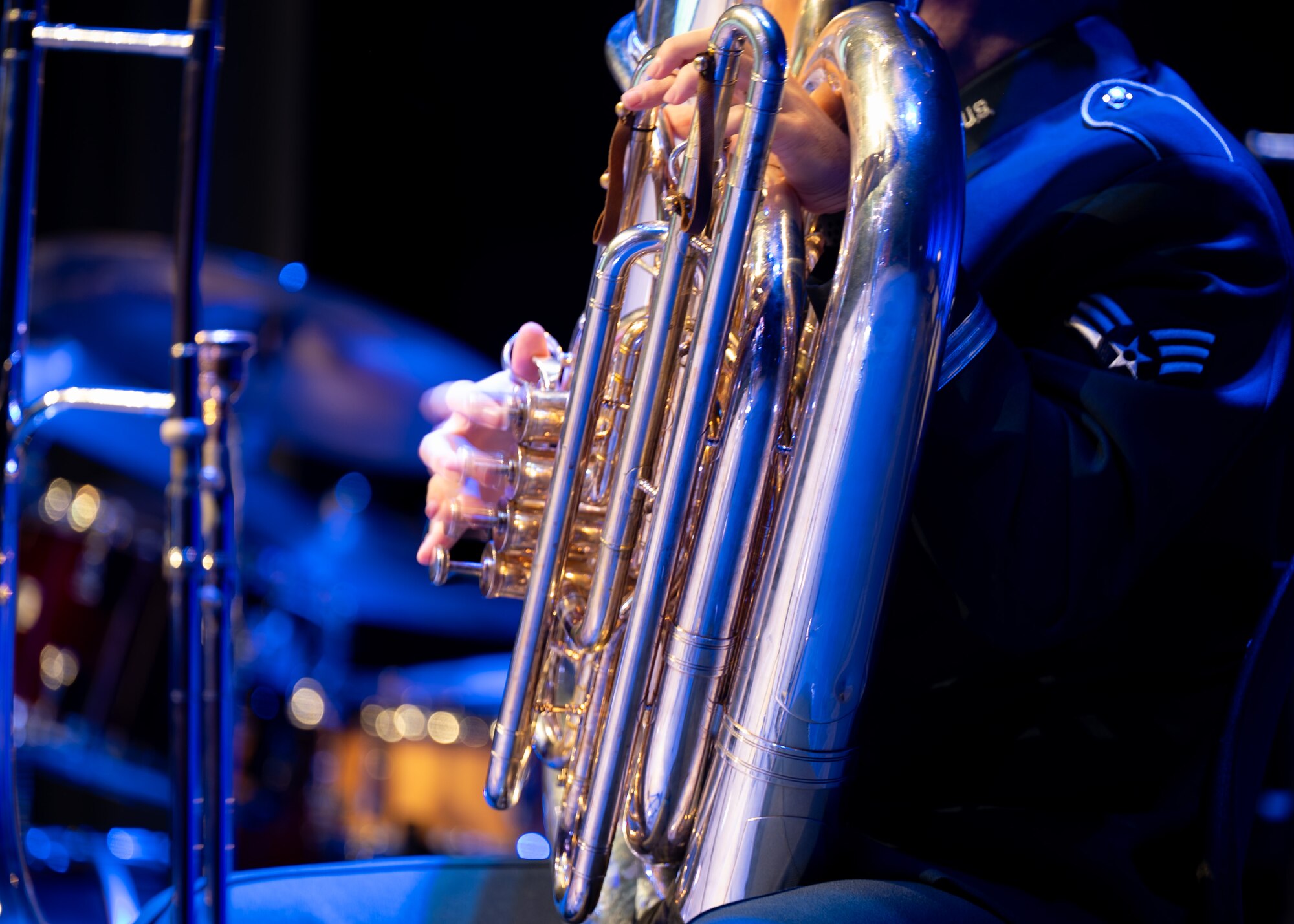 Airman plays tuba on stage