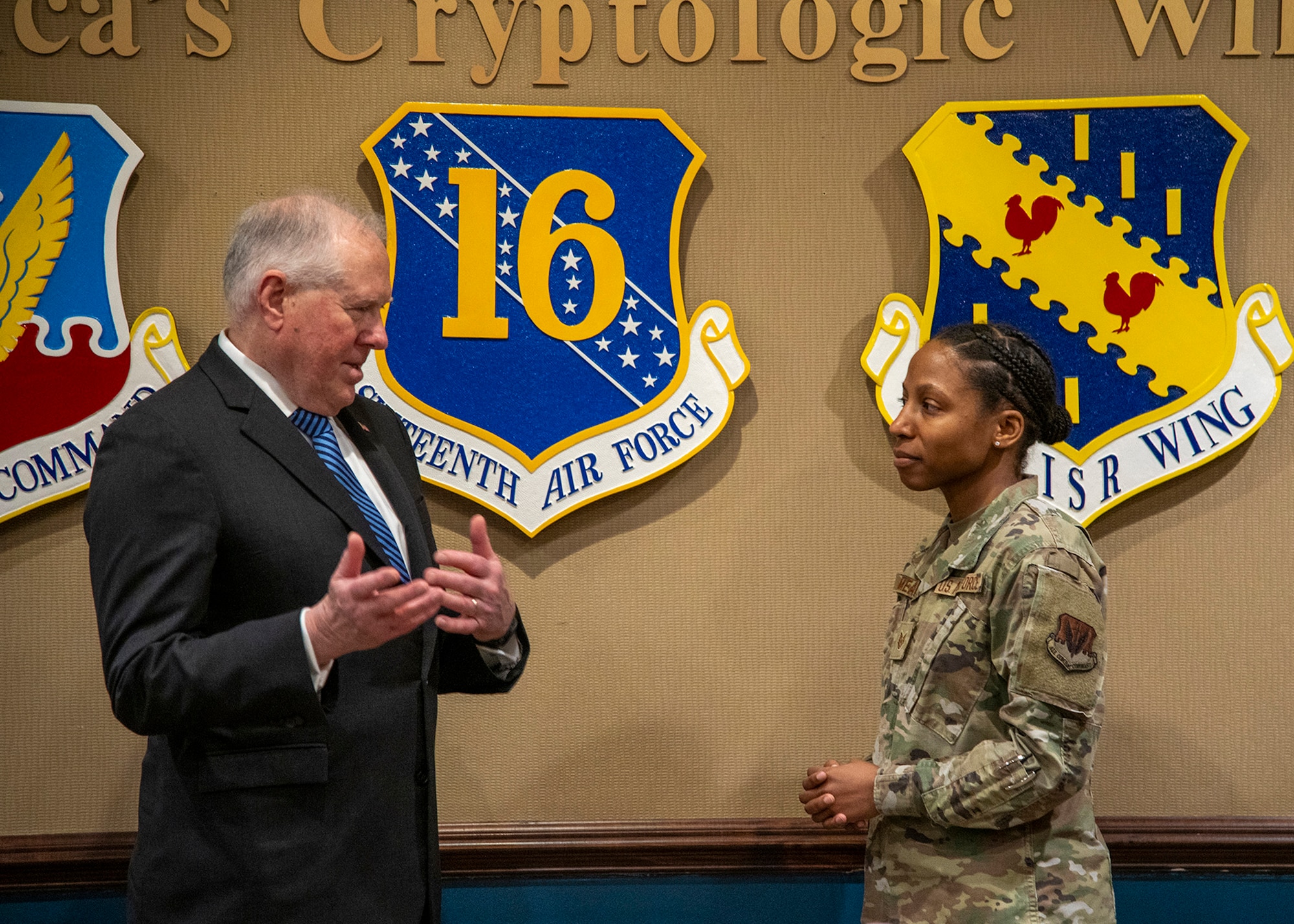Secretary of the Air Force Frank Kendall speaks with Tech. Sgt. Shannon Meads, 70th Operations Support Squadron publicly available information operations noncommissioned officer in charge, during a visit at Fort George G. Meade, Md., Feb. 2, 2024