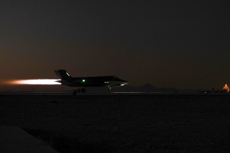 A U.S. Marine Corps F-35B Lightning II aircraft with Marine Fighter Attack Squadron (VMFA) 211, Marine Aircraft Group 13, 3rd Marine Aircraft Wing, takes off during suppression of enemy air defense training in support of Exercise Steel Knight 23.2 at Marine Corps Air Station Yuma, Arizona, Dec. 7, 2023. SEAD training increases the ability of fifth-generation fighter pilots to enter the fight first, strike targets deep within an enemy air defense system, and enable follow on strikes by supporting weapons platforms. Steel Knight 23.2 is a three-phase exercise designed to train I Marine Expeditionary Force in the planning, deployment and command and control of a joint force against a peer or near-peer adversary combat force and enhance existing live-fire and maneuver capabilities of the Marine Air-Ground Task Force. (U.S. Marine Corps photo by Lance Cpl. Elizabeth Gallagher)