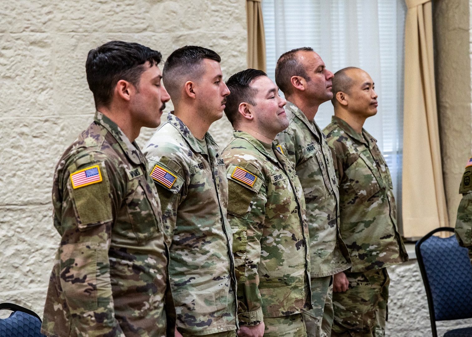 Soldiers form the 6th Battalion, 54th Security Forces Assistance Brigade’s Logistics Advisor Team 6612 stand as their deployment order is read during a ceremony held at Heritage Hall at Rock Island Arsenal, Illinois. The small, specialized team is deploying to the Philippines to advise and assist the Filippino armed forces, replacing another team slated to come home later in February. (U.S. Army photo by Sgt. 1st Class Bryan Spreitzer, Illinois National Guard Public Affairs.)