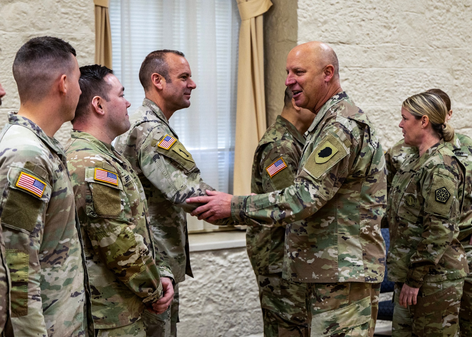 Chief Warrant Officer 5 Thomas Black, State Command Chief Warrant Officer for the Illinois Army National Guard and Lt. Col. Beth Roxworthy, Commander of the 34th Division Sustainment Brigade, “troop the line” for Logistics Advisor Team 6612 during a mobilization ceremony at Rock Island Arsenal, Illinios.