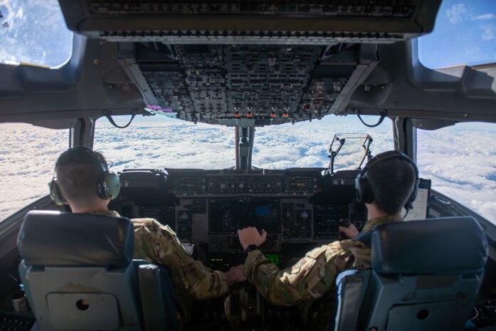 A plane flies in the sky.