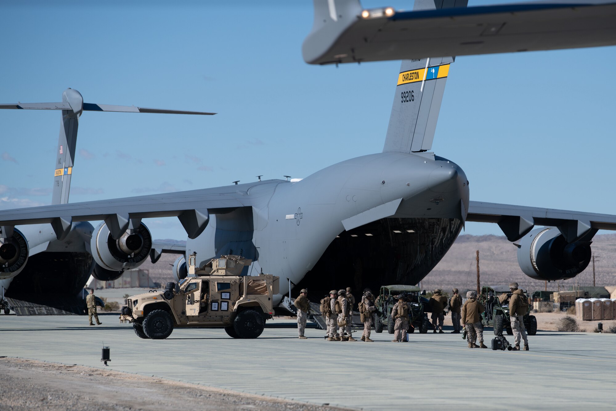 U.S. Marines load cargo into a plane.