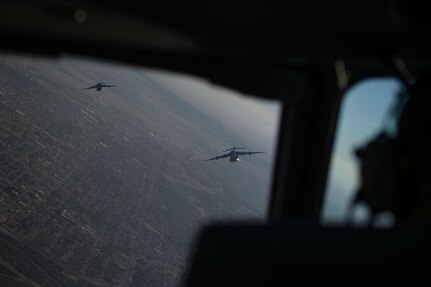 Two planes fly in the sky.