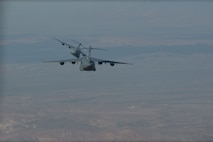 Two planes fly in the sky.