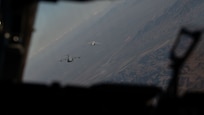 Two planes fly in the sky.