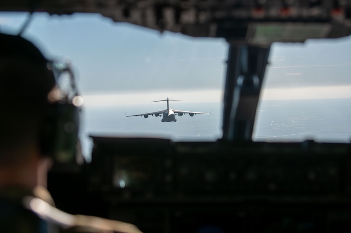 A plane flies in the sky.