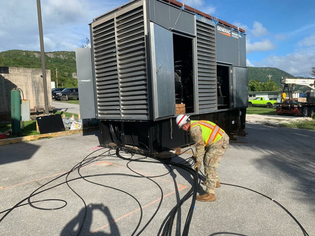 A Soldier of the 249th Engineer Battalion connects a generator at a site during a mission in Saipan. The U.S. Army Corps of Engineers, Savannah District, Emergency Power Planning and Response Team works closely with the 249th Engineer Battalion, providing technical expertise and conducting assessments during each mission.