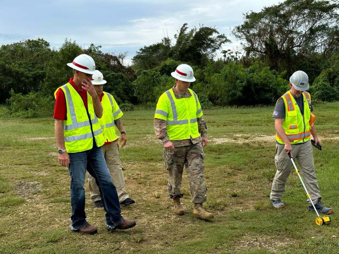 Members of the U.S. Army Corps of Engineers, Savannah District, Emergency Power Planning and Response team, including Leland Tenijenhuis, electrician, and Master Sgt. Shermaine Malone, contract specialist, collaborate with the 249th Engineer Battalion and the contractor to evaluate a site for the possible placement of a generator during a mission in Saipan.