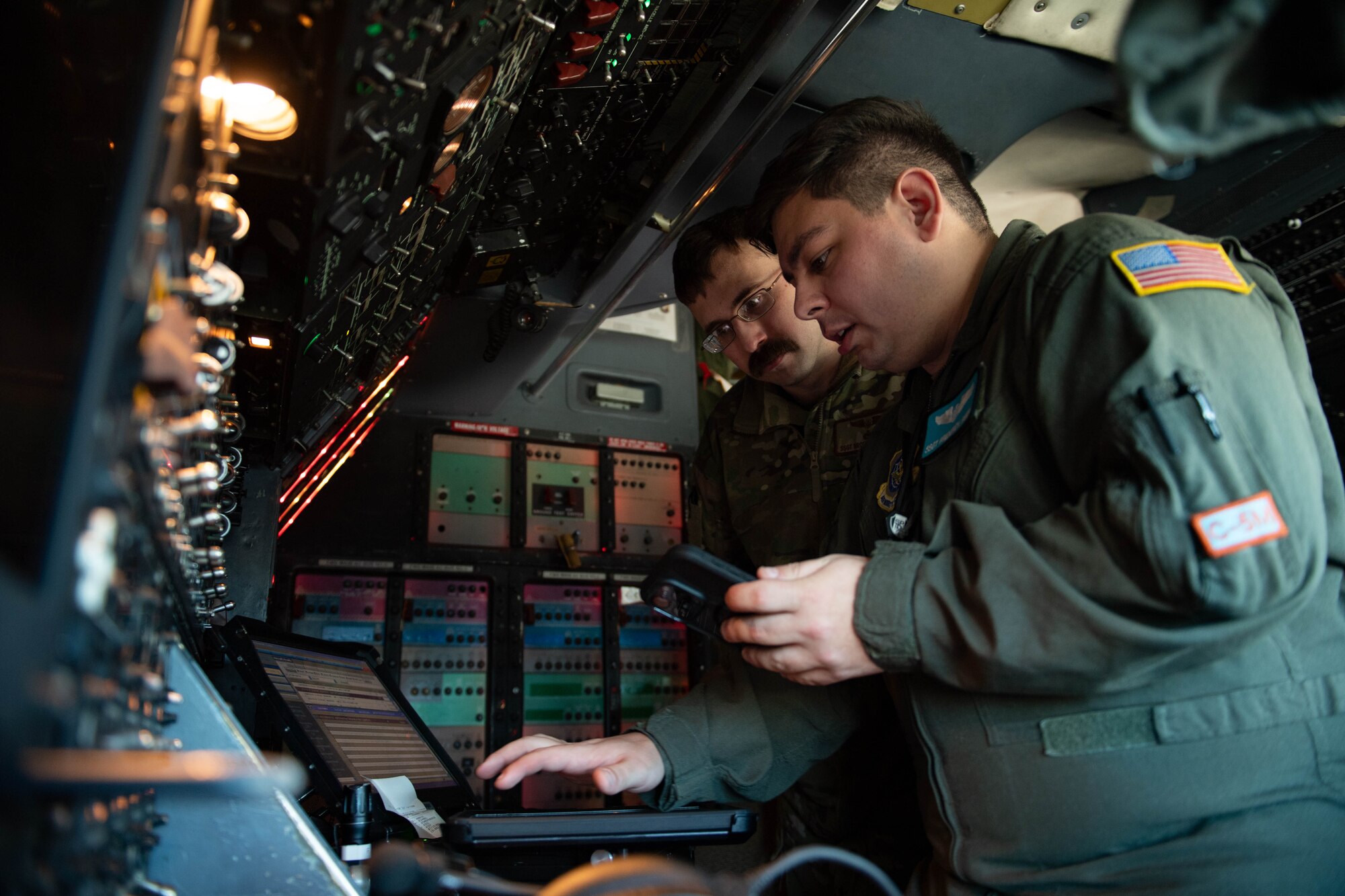 U.S. Air Force Staff Sgts. Fred Reidy and Broden McDonald, 9th Airlift Squadron flight engineers, conduct pre-flight checks at Dover Air Force Base, Delaware, Feb. 7, 2024. The flight crew delivered a C-5M Super Galaxy to Westover Air Reserve Base, Massachusetts for an isochronal maintenance inspection. (U.S. Air Force photo by Tech. Sgt. J.D. Strong II)