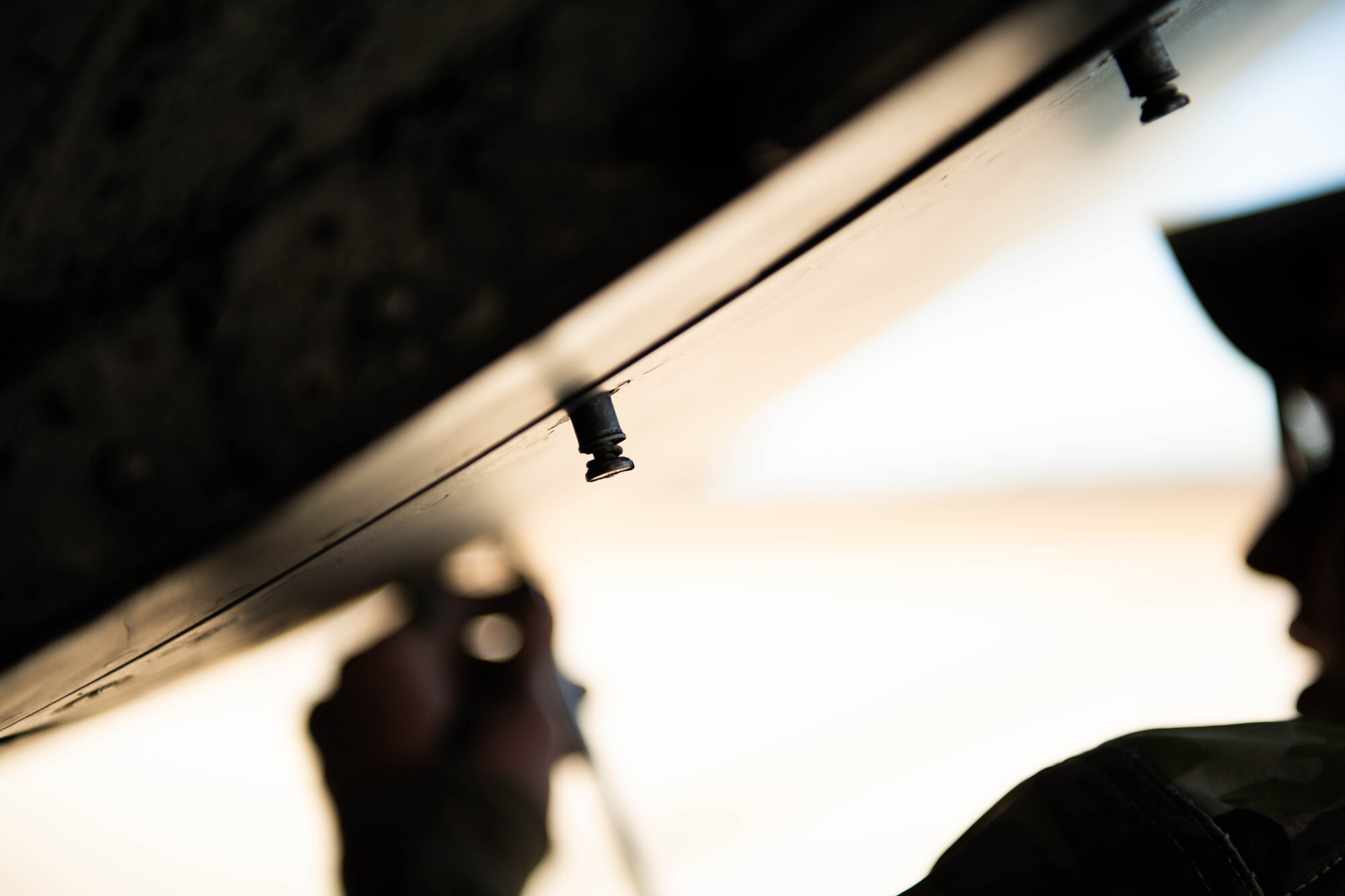 A screw waits to be tightened on a C-5M Super Galaxy at Dover Air Force Base, Delaware, Feb. 7, 2024. The C-5M Super Galaxy was delivered to Westover Air Reserve Base, Massachusetts for an isochronal maintenance inspection. (U.S. Air Force photo by Tech. Sgt. J.D. Strong II)