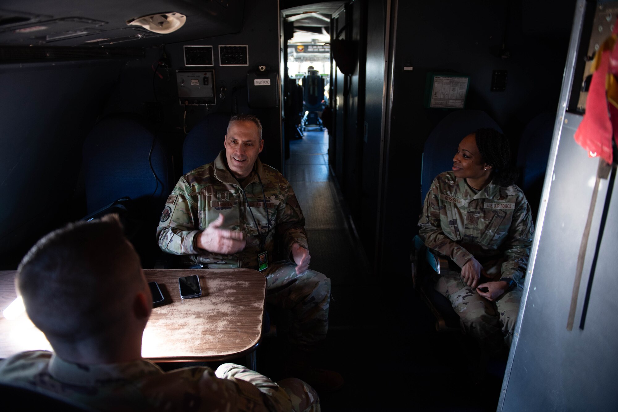 U.S. Air Force Chief Master Sgt. Carolyn Russell, 436th Airlift Wing command chief, and U.S. Air Force Chief Master Sgt. Jaysen Lausten, 436th Maintenance Squadron senior enlisted leader, converse in a C-5M Super Galaxy at Dover Air Force Base, Delaware, Feb. 7, 2024. During the visit, the senior leaders toured the C-5 Isochronal Maintenance Dock and conducted an all-call to members of the 436th Maintenance Squadron, Operating Location Alpha, a tenant unit of the 436th AW. (U.S. Air Force photo by Tech. Sgt. J.D. Strong II)