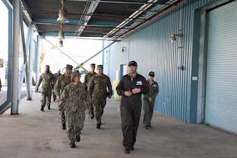 INDIAN HEAD, Md. (Feb. 9, 2024) - Dale Cornette, a mechanical engineer at Naval Surface Warfare Center Indian Head Division (NSWC IHD), briefs Chief of Naval Operations Adm. Lisa Franchetti during a tour of NSWC IHD in Indian Head, Md., Feb. 9. Franchetti was able to see first-hand the high-end technological advancements in Navy munitions that Sailors and civilians are making at NSWC IHD. (U.S. Navy photo by Mass Communication Specialist 1st Class William Spears)