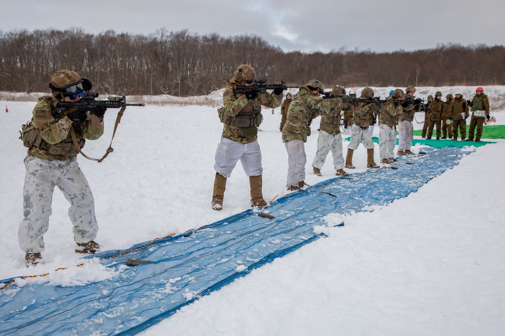 U.S. Paratroopers with 1st Battalion, 501st Parachute Regiment, 2nd Infantry Brigade, 11th Airborne Division participate in a shooting competition held between squads from their battalion and squads of Japanese Ground Self-Defense Force (JGSDF) members with 28th Infantry Regiment, 11th Brigade, Northern Army during North Wind 24, Jan. 26, 2024 on JGSDF Hokudai-en Training Area in Chitose, Hokkaido. The shooting competition had each squad run 100 meters, reload their weapons, and fire at two targets on a silhouette, with squad members that didn’t hit both targets each round being disqualified; the side with the most squad members left at the end wins. North Wind is a bilateral cold-weather field training exercise held between the U.S. Army and JGSDF where the allies exchange tactics and techniques; this year’s exercise is the 31st North Wind.