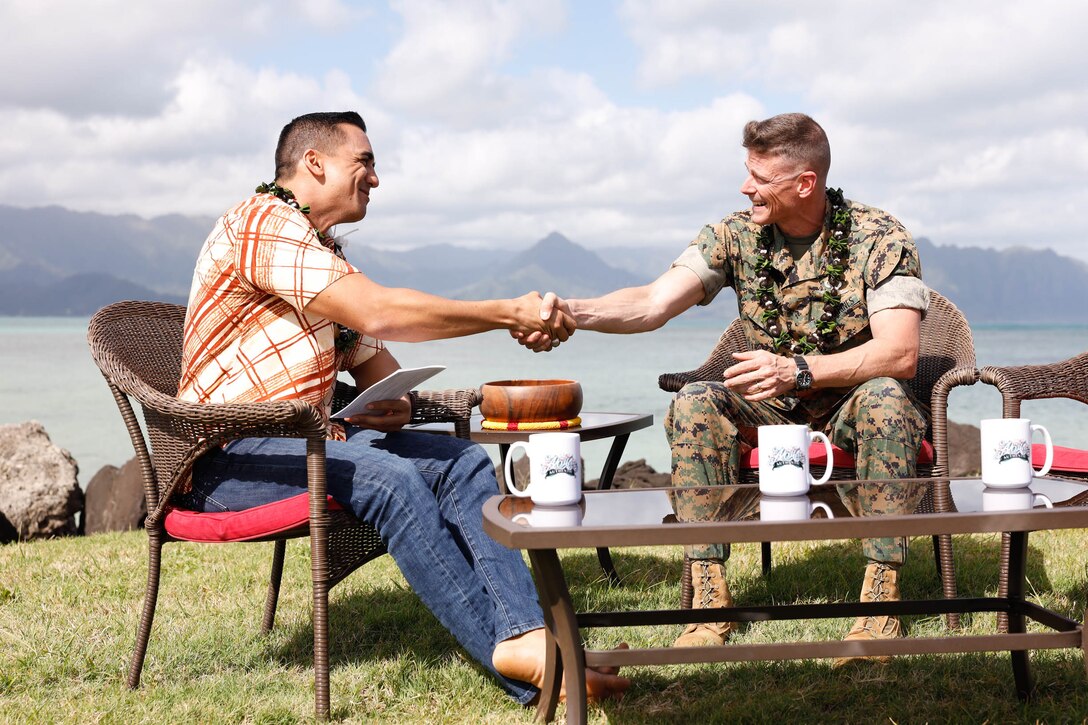 U.S. Marine Corps Col. Jeremy Beaven, right, commanding officer, Marine Corps Base Hawaii, shakes hands with Kamaka Pili, left, host of "Aloha Authentic", after filming a news segment at MCBH, Hawaii, Jan. 22, 2024. The news segment covered discussion of topics including base access, natural resource use, and community concerns in an effort to spark dialogue between base leadership and community members. (U.S. Marine Corps photo by Sgt. Brandon Aultman)