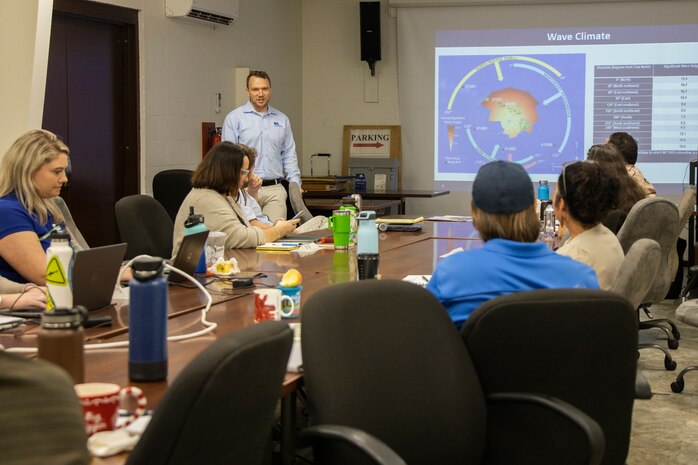 Sam Whitin, the director of Coastal Resilience at EA Engineering, Science, and Technology, discusses ways to increase the resilience of Marine Corps resources using nature-based solutions during a meeting with members representing Marstel-Day, Jacobs, Environmental Compliance and Protection Division, and Marine Corps Base Hawaii staff through the Engineering with Nature program at MCBH, Jan. 30, 2024. The main efforts of the project will be to improve coastal resilience while maintaining beach training abilities at Marine Corps Training Area Bellows and Pu’uloa Range Training Facility. (U.S. Marine Corps photo by Sgt. Julian Elliott-Drouin)